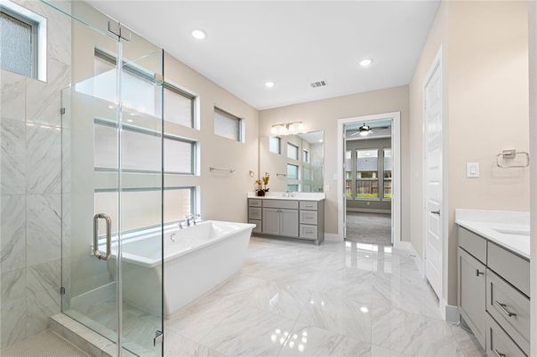 Bathroom, Dual Sink Vanities, Free Standing Baths, Glass Shower, Interior, Marble, Marble Walls, Recessed Lighting