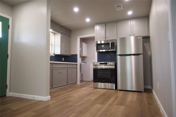 Interior, Kitchen, Recessed Lighting, Stainless Steel Appliances, Wood Texture Flooring