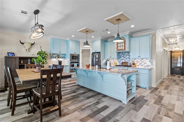 Dining room, Interior, Kitchen, Pendant Lights, Recessed Lighting, Stainless Steel Appliances, Wood Texture Flooring