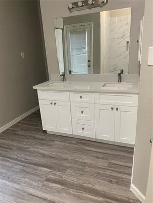 Bathroom, Dual Sink Vanities, Interior, Marble Walls, Wood Texture Flooring