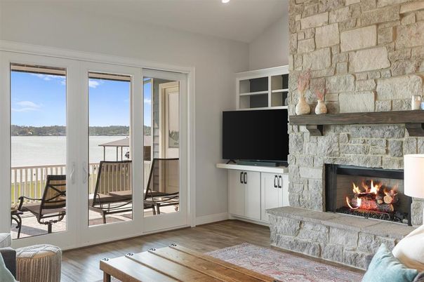 Fireplace, Interior, Recessed Lighting, Stone Walls, Water, Wood Texture Flooring