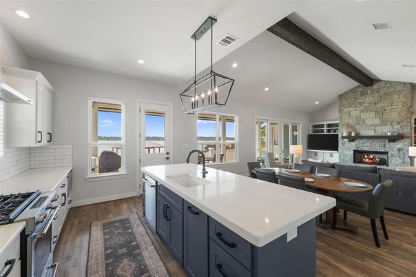 Dining room, Fireplace, Interior, Kitchen, Living room, Pendant Lights, Recessed Lighting, Stainless Steel Appliances, Stone Walls, Wooden Beams, Wood Texture Flooring