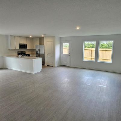 Empty room, Interior, Kitchen, Recessed Lighting, Stainless Steel Appliances, Wood Texture Flooring