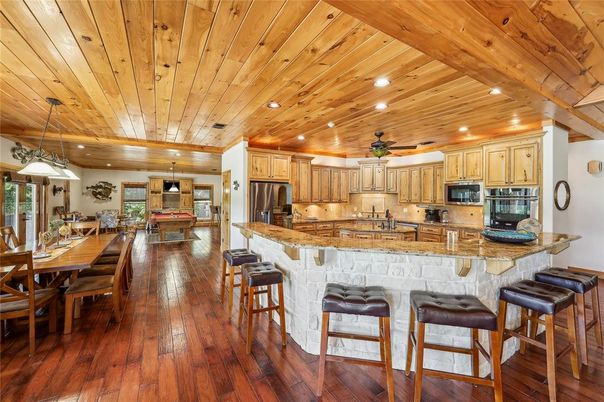 Dining room, Interior, Kitchen, Pendant Lights, Recessed Lighting, Stainless Steel Appliances, Wooden Ceilings, Wood Texture Flooring