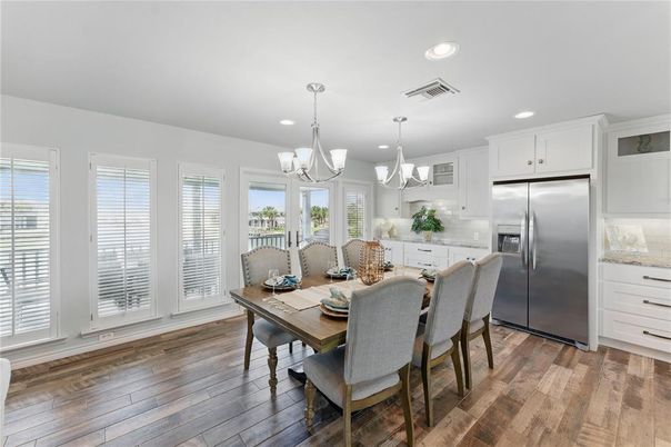 Chandelier, Dining room, Interior, Kitchen, Pendant Lights, Recessed Lighting, Stainless Steel Appliances, Wood Texture Flooring