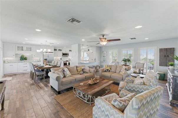 Chandelier, Dining room, Interior, Kitchen, Living room, Pendant Lights, Recessed Lighting, Stainless Steel Appliances, Wood Texture Flooring