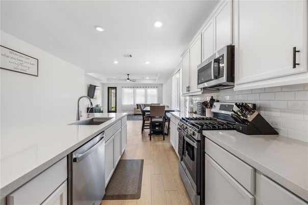 Dining room, Interior, Kitchen, Recessed Lighting, Stainless Steel Appliances, Wood Texture Flooring
