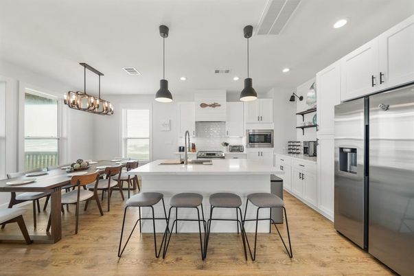 Dining room, Interior, Kitchen, Pendant Lights, Recessed Lighting, Stainless Steel Appliances, Wood Texture Flooring