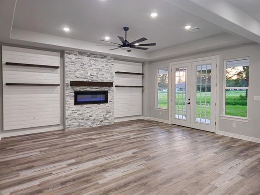 Empty room, Fireplace, Interior, Recessed Lighting, Stone Walls, Wood Texture Flooring