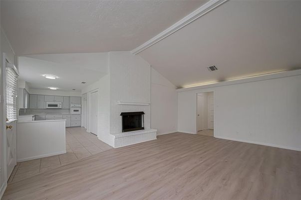 Empty room, Fireplace, Interior, Kitchen, Recessed Lighting, Wood Texture Flooring