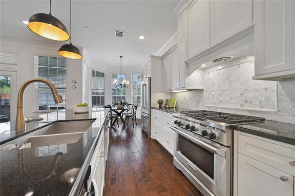 Chandelier, Dining room, Interior, Kitchen, Pendant Lights, Recessed Lighting, Stainless Steel Appliances, Wood Texture Flooring