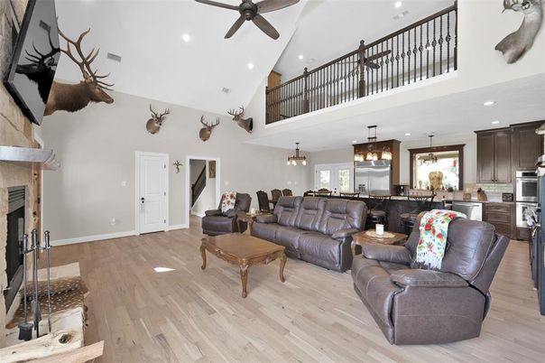 Dining room, Fireplace, Interior, Kitchen, Living room, Pendant Lights, Recessed Lighting, Stainless Steel Appliances, Wood Texture Flooring