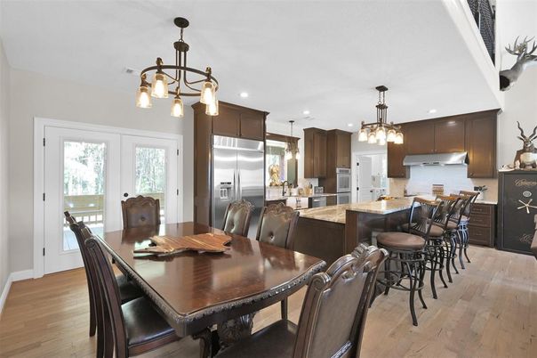 Dining room, Interior, Kitchen, Pendant Lights, Recessed Lighting, Stainless Steel Appliances, Wood Texture Flooring