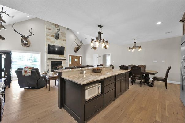 Dining room, Fireplace, Interior, Kitchen, Living room, Pendant Lights, Recessed Lighting, Stone Walls, Wood Texture Flooring