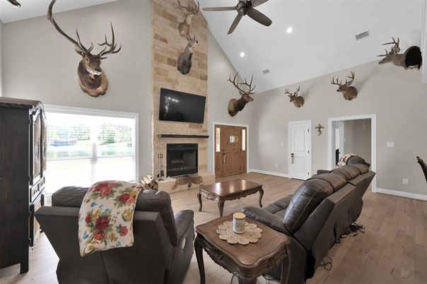 Fireplace, Interior, Living room, Recessed Lighting, Stone Walls, Wood Texture Flooring