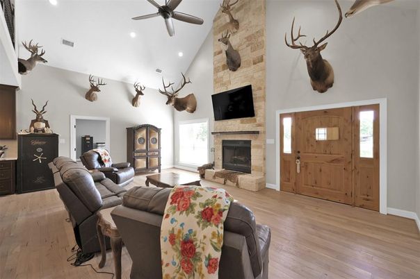 Fireplace, Interior, Living room, Recessed Lighting, Stone Walls, Wood Texture Flooring