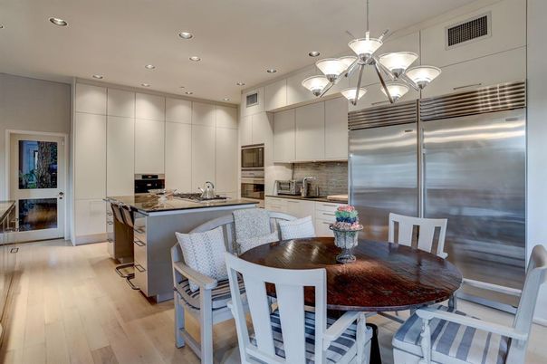 Chandelier, Dining room, Interior, Kitchen, Pendant Lights, Recessed Lighting, Stainless Steel Appliances, Wood Texture Flooring