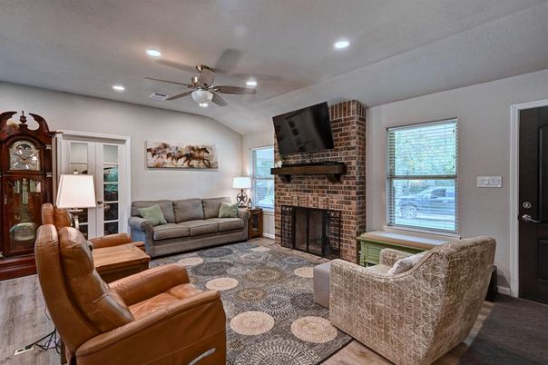 Fireplace, Interior, Living room, Recessed Lighting, Stone Walls, Wood Texture Flooring