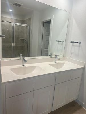 Bathroom, Dual Sink Vanities, Glass Shower, Interior, Recessed Lighting, Wood Texture Flooring