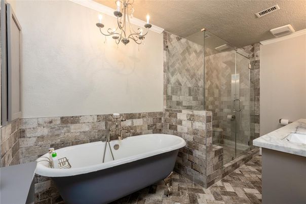 Bathroom, Chandelier, Free Standing Baths, Glass Shower, Interior, Stone Walls