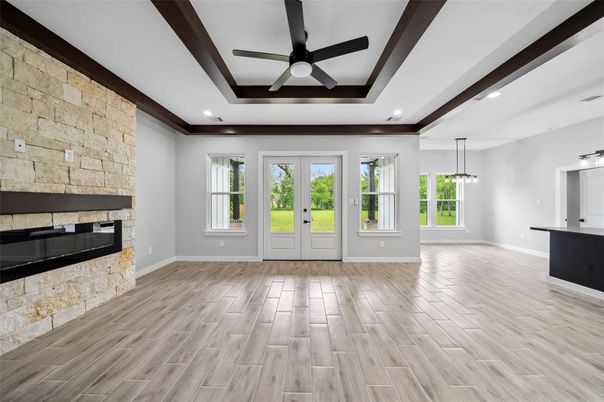 Fireplace, Interior, Pendant Lights, Recessed Lighting, Stone Walls, Wood Texture Flooring