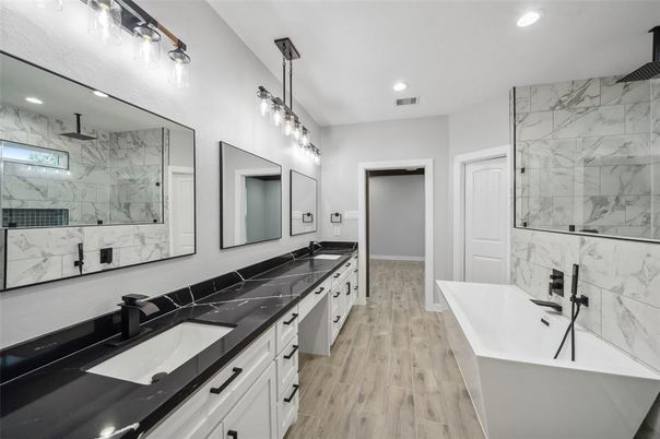 Bathroom, Dual Sink Vanities, Free Standing Baths, Interior, Marble Walls, Recessed Lighting, Wood Texture Flooring
