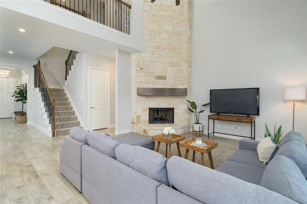 Fireplace, Interior, Living room, Recessed Lighting, Stone Walls, Wood Texture Flooring