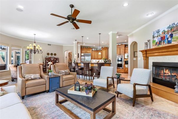 Chandelier, Dining room, Fireplace, Interior, Kitchen, Living room, Pendant Lights, Recessed Lighting, Stainless Steel Appliances