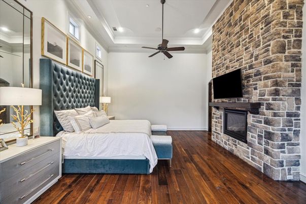 Bedroom, Fireplace, Interior, Recessed Lighting, Stone Walls, Wood Texture Flooring