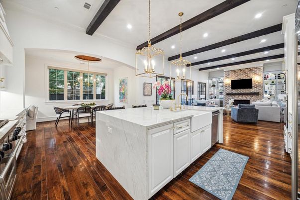 Dining room, Fireplace, Interior, Kitchen, Living room, Pendant Lights, Recessed Lighting, Stainless Steel Appliances, Stone Walls, Wooden Beams, Wood Texture Flooring