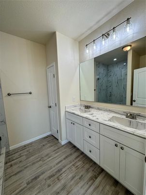 Bathroom, Dual Sink Vanities, Interior, Marble Walls, Wood Texture Flooring