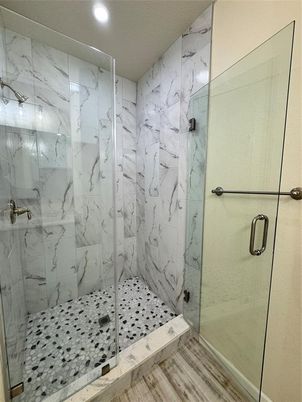 Bathroom, Glass Shower, Interior, Marble Walls, Recessed Lighting, Wood Texture Flooring