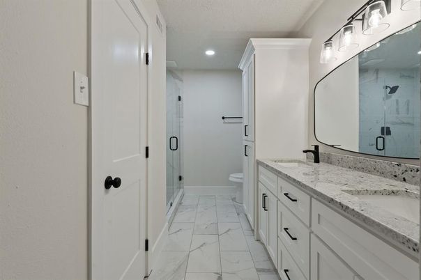 Bathroom, Dual Sink Vanities, Glass Shower, Interior, Marble, Marble Walls, Recessed Lighting