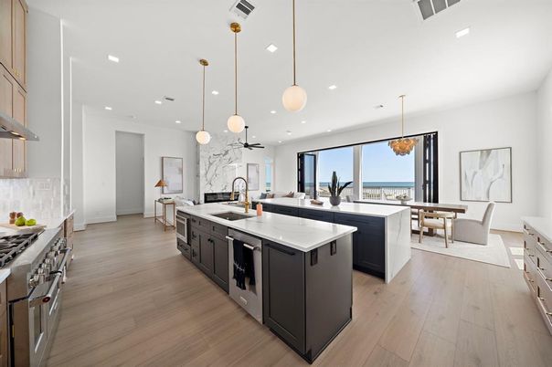 Dining room, Interior, Kitchen, Pendant Lights, Recessed Lighting, Stainless Steel Appliances, Water, Wood Texture Flooring
