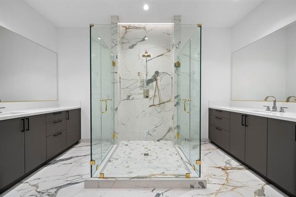 Bathroom, Dual Sink Vanities, Glass Shower, Interior, Marble, Marble Walls, Recessed Lighting