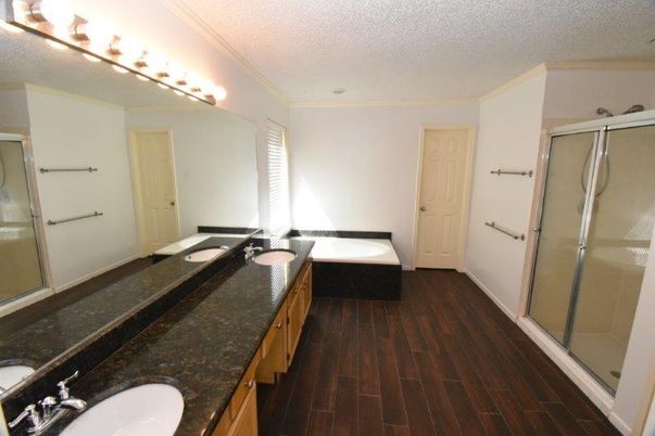 Bathroom, Dual Sink Vanities, Glass Shower, Interior, Wood Texture Flooring