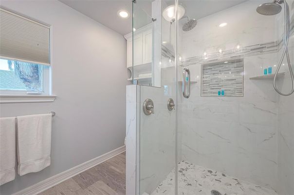 Bathroom, Glass Shower, Interior, Marble Walls, Recessed Lighting, Wood Texture Flooring