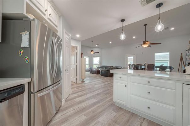 Dining room, Interior, Kitchen, Living room, Pendant Lights, Recessed Lighting, Stainless Steel Appliances, Wood Texture Flooring