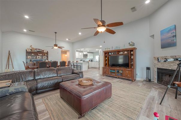 Dining room, Fireplace, Interior, Living room, Recessed Lighting, Wood Texture Flooring