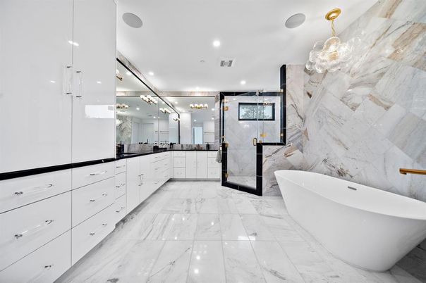Bathroom, Dual Sink Vanities, Free Standing Baths, Interior, Marble, Marble Walls, Pendant Lights, Recessed Lighting