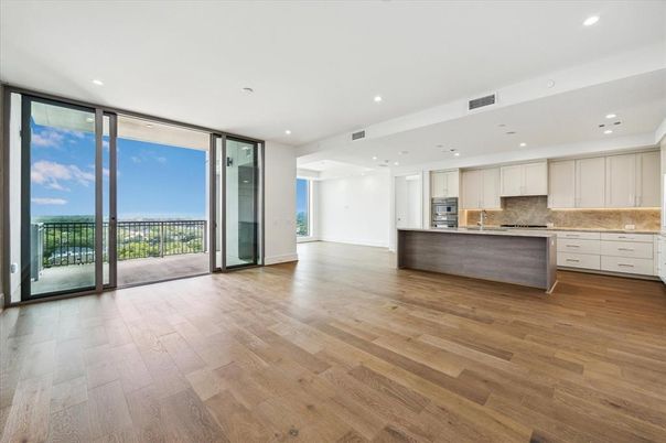 Empty room, Interior, Kitchen, Recessed Lighting, Stainless Steel Appliances, Wood Texture Flooring