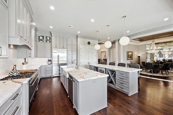 Chandelier, Dining room, Interior, Kitchen, Pendant Lights, Recessed Lighting, Stainless Steel Appliances, Wood Texture Flooring