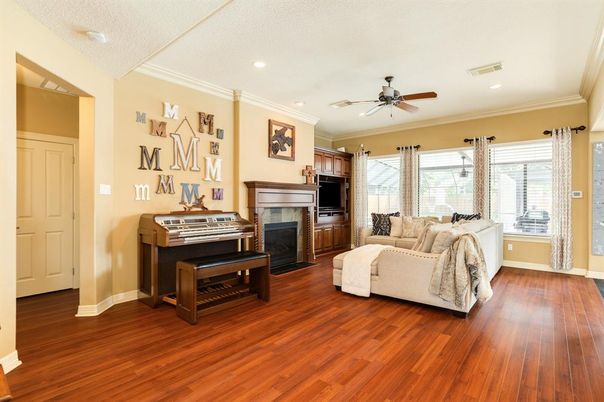 Fireplace, Interior, Living room, Piano, Recessed Lighting, Wood Texture Flooring