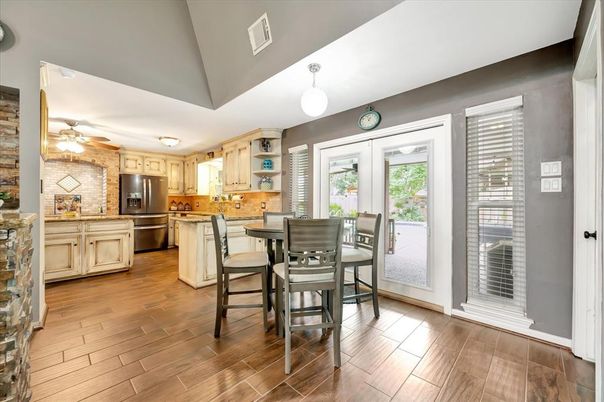 Dining room, Interior, Kitchen, Pendant Lights, Stainless Steel Appliances, Stone Walls, Wood Texture Flooring