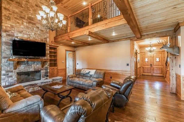 Chandelier, Fireplace, Interior, Living room, Recessed Lighting, Stone Walls, Wooden Beams, Wooden Ceilings, Wood Texture Flooring