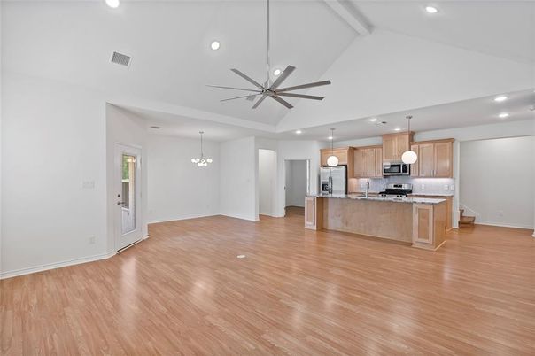 Chandelier, Empty room, Interior, Kitchen, Pendant Lights, Recessed Lighting, Stainless Steel Appliances, Wood Texture Flooring