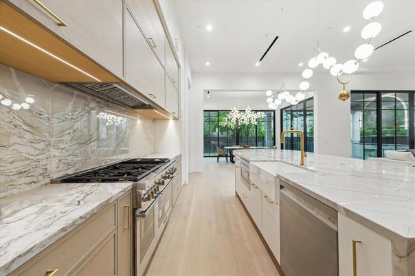 Interior, Kitchen, Marble Walls, Pendant Lights, Recessed Lighting, Stainless Steel Appliances, Wood Texture Flooring