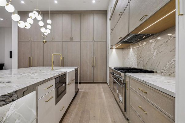 Interior, Kitchen, Marble Walls, Pendant Lights, Recessed Lighting, Stainless Steel Appliances, Wood Texture Flooring