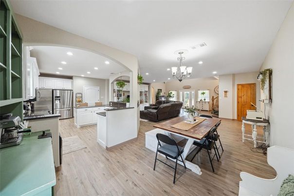 Chandelier, Interior, Kitchen, Living room, Recessed Lighting, Stainless Steel Appliances, Wood Texture Flooring
