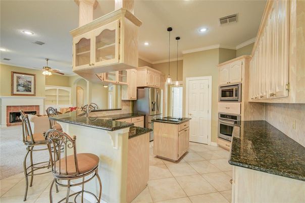 Dining room, Fireplace, Interior, Kitchen, Pendant Lights, Recessed Lighting, Stainless Steel Appliances